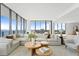Bright living room boasts expansive windows and city views at 2912 W Santiago St # Ph2402, Tampa, FL 33629