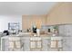 Contemporary kitchen featuring marble countertops and breakfast bar seating at 2912 W Santiago St # Ph2402, Tampa, FL 33629