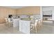 Open concept kitchen with marble island and light wood cabinetry at 2912 W Santiago St # Ph2402, Tampa, FL 33629