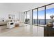 Spacious bedroom with a king-size bed and floor-to-ceiling windows showcasing water views at 2912 W Santiago St # Ph2402, Tampa, FL 33629