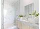 Elegant bathroom with marble finishes and a large mirror at 2912 W Santiago St # Ph2402, Tampa, FL 33629