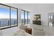 Main bedroom with a king-size bed and stunning water views from floor-to-ceiling windows at 2912 W Santiago St # Ph2402, Tampa, FL 33629
