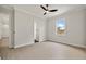 Bright bedroom with wood-look floors and access to a bathroom at 1233 Acappella Ln, Apollo Beach, FL 33572