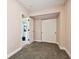 Bedroom with closet and open door to a full bathroom at 509 E Paris St, Tampa, FL 33604