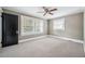 Spacious bedroom with ceiling fan and neutral carpeting at 455 13Th Ne Ave, St Petersburg, FL 33701