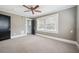 Well-lit bedroom with ceiling fan and neutral carpeting at 455 13Th Ne Ave, St Petersburg, FL 33701