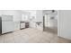 Simple kitchen with white cabinets and tile floors at 455 13Th Ne Ave, St Petersburg, FL 33701