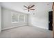 Charming bedroom with ceiling fan and neutral carpeting at 455 13Th Ne Ave, St Petersburg, FL 33701
