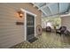 Front porch with vintage wagon wheel and comfortable seating at 455 13Th Ne Ave, St Petersburg, FL 33701