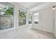 Bright sunroom with tile floors and access to backyard at 455 13Th Ne Ave, St Petersburg, FL 33701