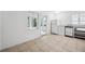 Efficient kitchen with white appliances and tile floor at 455 13Th Ne Ave, St Petersburg, FL 33701