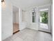 Spacious sunroom with tile floors and access to backyard at 455 13Th Ne Ave, St Petersburg, FL 33701