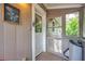 Screened porch entrance with white door and view of backyard at 455 13Th Ne Ave, St Petersburg, FL 33701