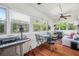 Charming sunroom with hardwood floors and plenty of windows at 455 13Th Ne Ave, St Petersburg, FL 33701