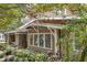 Side view of a Craftsman home with lovely landscaping at 455 13Th Ne Ave, St Petersburg, FL 33701