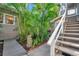 Pathway through tropical landscaping with stone feature at 455 13Th Ne Ave, St Petersburg, FL 33701