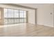 Bright living room with wide windows and vinyl flooring at 31 Island Way # 502, Clearwater Beach, FL 33767