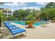 Inviting community pool with lounge chairs and lush landscaping at 4207 S Dale Mabry Hwy # 11109, Tampa, FL 33611