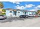 Exterior view of a light blue building with parking and landscaping at 3730 42Nd S Way # G, St Petersburg, FL 33711