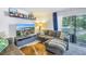 Living room with sectional sofa, TV and view to patio at 3730 42Nd S Way # G, St Petersburg, FL 33711