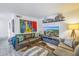 Cozy living room with sectional sofa and wall-mounted TV at 3730 42Nd S Way # G, St Petersburg, FL 33711