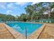 Inviting community pool with surrounding lounge chairs at 3730 42Nd S Way # G, St Petersburg, FL 33711