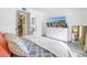 Bright bedroom with a comfy bed, large dresser, and access to hallway at 3730 42Nd S Way # G, St Petersburg, FL 33711