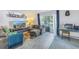 Relaxing living room featuring a sectional sofa and a large TV at 3730 42Nd S Way # G, St Petersburg, FL 33711