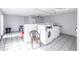 Well-lit laundry room featuring several washers and dryers at 3730 42Nd S Way # G, St Petersburg, FL 33711