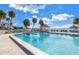 Inviting community pool with surrounding lounge chairs at 3730 42Nd S Way # G, St Petersburg, FL 33711