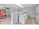 Clean laundry room with several washers and dryers at 3730 42Nd S Way # G, St Petersburg, FL 33711