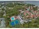 Aerial view showing community layout, pool, and tennis courts at 3730 42Nd S Way # G, St Petersburg, FL 33711