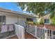 Private deck with wooden railing and potted plants at 3730 42Nd S Way # G, St Petersburg, FL 33711