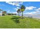 Scenic waterfront view with lush green lawn at 3730 42Nd S Way # G, St Petersburg, FL 33711