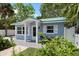 Charming light blue cottage with white trim and landscaping at 724 Gulf Blvd # A & B, Indian Rocks Beach, FL 33785