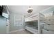 Charming bedroom with a bunk bed and window at 724 Gulf Blvd # A & B, Indian Rocks Beach, FL 33785