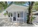 Charming front porch with white railings and seating area at 724 Gulf Blvd # A & B, Indian Rocks Beach, FL 33785
