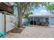 Spacious backyard with brick patio and lush greenery at 724 Gulf Blvd # A & B, Indian Rocks Beach, FL 33785