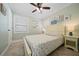 Bright bedroom featuring a queen-size bed and beach decor at 724 Gulf Blvd # A & B, Indian Rocks Beach, FL 33785