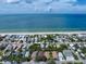 Wide aerial view of neighborhood and coastline at 724 Gulf Blvd # A & B, Indian Rocks Beach, FL 33785