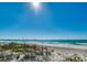 Stunning beach view with white sand and blue water under a bright sunny sky at 724 Gulf Blvd # A & B, Indian Rocks Beach, FL 33785