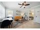 Open living space with a yellow couch, dining area, and view of bedroom at 724 Gulf Blvd # A & B, Indian Rocks Beach, FL 33785