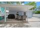 Outdoor patio with covered seating area and grill at 724 Gulf Blvd # A & B, Indian Rocks Beach, FL 33785
