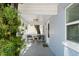 Front porch with seating for two at 724 Gulf Blvd # A & B, Indian Rocks Beach, FL 33785