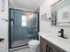 Updated bathroom with a walk-in shower and modern vanity at 724 Gulf Blvd # A & B, Indian Rocks Beach, FL 33785