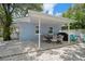 Outdoor patio with covered seating area and grill at 724 Gulf Blvd # A & B, Indian Rocks Beach, FL 33785