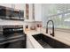 Sleek kitchen with stainless steel appliances and a modern sink at 724 Gulf Blvd # A & B, Indian Rocks Beach, FL 33785