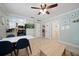 Bright living room with open floor plan, dining area, and view into kitchen at 724 Gulf Blvd # A & B, Indian Rocks Beach, FL 33785