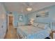 Serene bedroom with light blue walls and a ceiling fan at 250 Rosery Nw Rd # 219, Largo, FL 33770