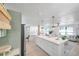 Modern kitchen with a large island, looking toward the living room at 1164 Murok S Way, St Petersburg, FL 33705